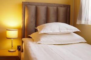 Garni Hotel Biser客房内的一张或多张床位