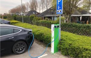 a car is being charged at a gas pump at Oud Kempen Bungalow 99 in Stavenisse