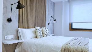 Postel nebo postele na pokoji v ubytování Apartamentos centro Vilagarcía