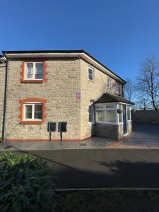 a large brick house with a driveway at JOY & House in Bristol