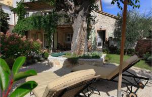a patio with a table and chairs in front of a house at Villa Moro in Poreč