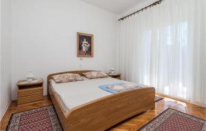 Postel nebo postele na pokoji v ubytování 3 Bedroom Nice Apartment In Barbat-Rab