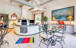 a living room with a large boat in a room at Lovely Home In Sainte-Marie-De-Ré in La Flotte