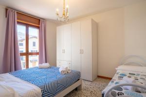Postel nebo postele na pokoji v ubytování Bellavista - Residence in Barzio center near free ski shuttle