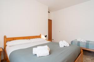 Postel nebo postele na pokoji v ubytování Bellavista - Residence in Barzio center near free ski shuttle