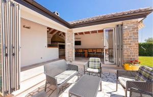 a patio in a home with chairs and tables at Villa Inga in Buje +36 photos