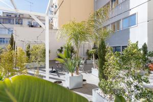 a courtyard with plants in a building at Pop the cork in Lisbon by Misha's Place 5B in Lisbon