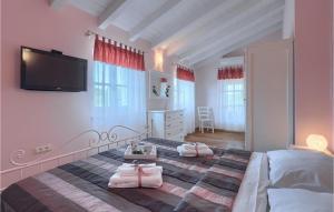 Postel nebo postele na pokoji v ubytování Villa Eni