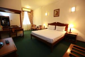 a hotel room with a bed and a desk at Hotel Sapphire in Colombo +66 photos