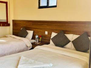 Postel nebo postele na pokoji v ubytování Hotel Lake Journey