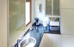 a kitchen with a sink and a counter top at 3 Bedroom Beautiful Home In Kirchheim in Kirchheim