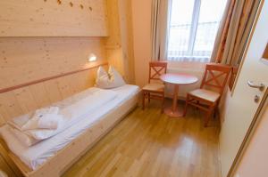 Rúm í herbergi á JUFA Hotel Gitschtal