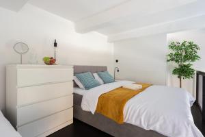 Postel nebo postele na pokoji v ubytování Modern loft-apartments in Prague