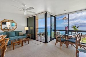 a living room with a couch and a table at KIHEI SURFSIDE, #403 condo in Wailea