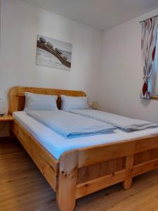 Posteľ alebo postele v izbe v ubytovaní Ferienwohnung Gstreinthaler