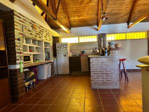 a kitchen with a refrigerator and a counter in a room at Casa los girasoles in La Rioja