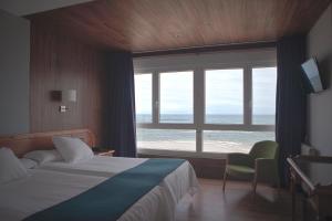 Postel nebo postele na pokoji v ubytování Hotel Josein