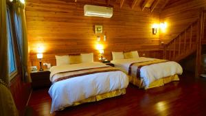 Postel nebo postele na pokoji v ubytování Ye Jiang Hua Homestay