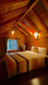 Postel nebo postele na pokoji v ubytování Ye Jiang Hua Homestay