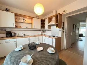 Kuchyň nebo kuchyňský kout v ubytování Appartement le Theven