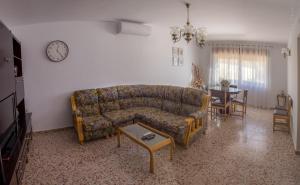 a living room with a couch and a table at Casa Rural Chache CASTO in Bienservida