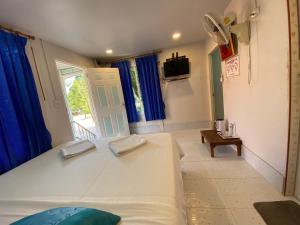 Postel nebo postele na pokoji v ubytování Patcharin Homestay