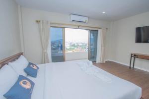 Postel nebo postele na pokoji v ubytování Aksarai hotel