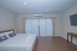 Postel nebo postele na pokoji v ubytování Aksarai hotel