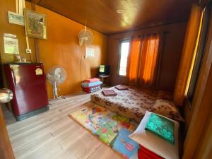 Postel nebo postele na pokoji v ubytování Patcharin Homestay