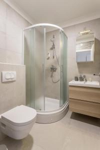 a bathroom with a shower and a toilet and a sink at Nikolica Apartments Pelješac in Potomje +18 photos