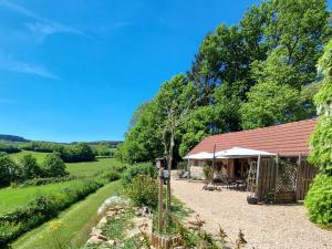 a cottage in the middle of a field with trees at ArcenFrance in Sussac +34 photos