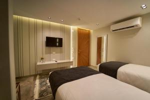 Letto o letti in una camera di Pyramids Charm Hotel