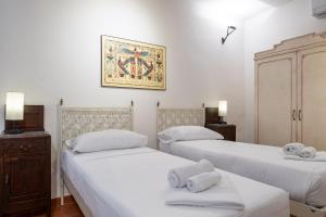 Posteľ alebo postele v izbe v ubytovaní Bargello Apartment