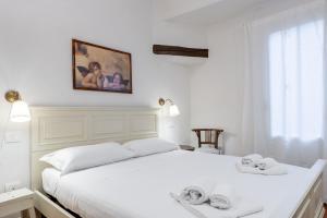 Posteľ alebo postele v izbe v ubytovaní Bargello Apartment