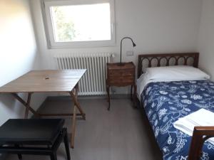 Postel nebo postele na pokoji v ubytování B&B Casa Cantoniera