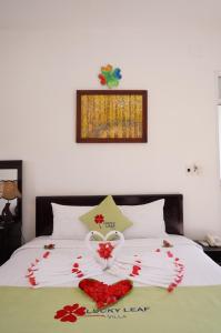 Postel nebo postele na pokoji v ubytování Tranquil Lucky Leaf Villa