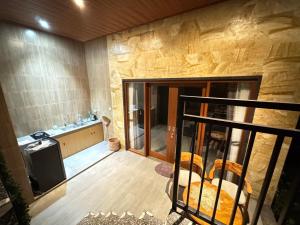 an empty room with a kitchen and a television at Ayu Homestay in Ubud +51 photos