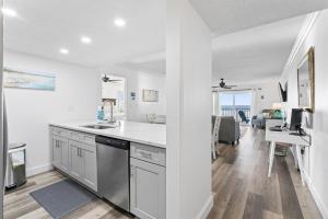 a kitchen with a sink and a counter top at Beachfront 3-Bed I Location! Stunning Sunsets in Clearwater Beach
