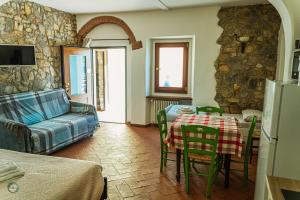 a living room with a table and a couch at La Valle di Anna in Lastra a Signa