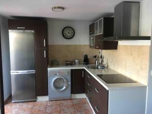 a kitchen with a washing machine and a dishwasher at You and me in El Bosque