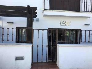 an entrance to a building with an iron gate at You and me in El Bosque