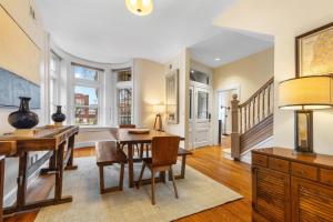 a kitchen and dining room with a table and chairs at Spacious and Central DC 3-BR Getaway Close to It All in Washington, D.C.