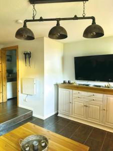 a living room with a large flat screen tv at Nicole in Quedlinburg