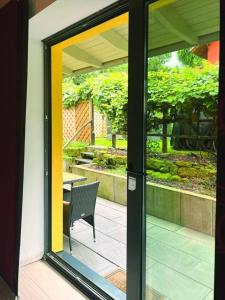 a sliding glass door leading to a patio with a table at Nicole II in Quedlinburg +16 photos