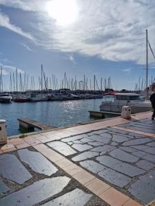 a marina with boats in the water and a pier at La Chrysalide - Classé 3 étoiles - 4 pers - Port du Cap d'agde - Plage - Clim - Wifi - Histoire de clés in Cap d'Agde