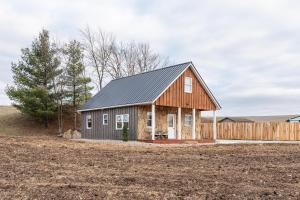 a barn house with a metal roof at Peaceful Valley Retreat in Sugarcreek