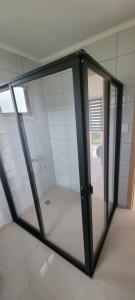 a room with a glass door in a room at Cabaña Nahuelbuta Adventure in Cañete +26 photos