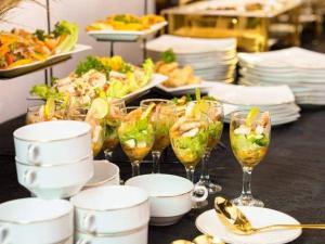 a buffet with glasses of food and plates of food at Sisiliyana Stone Resort in Gonapola