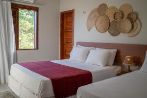 Ένα ή περισσότερα κρεβάτια σε δωμάτιο στο Vila Monã Jericoacoara