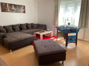 a living room with a couch and a table at Müritz Apartments in Waren